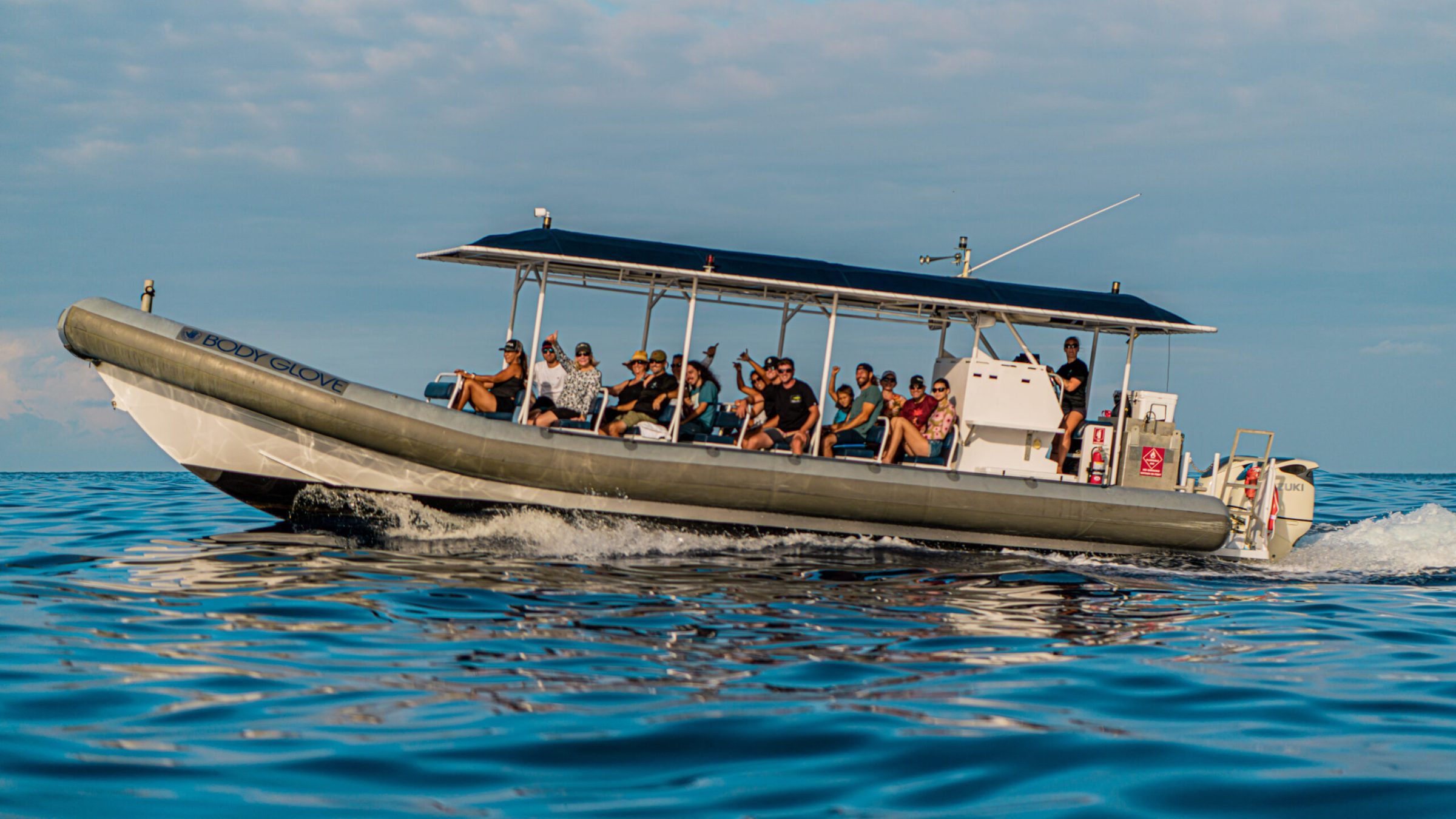 a group of people on a boat in the water