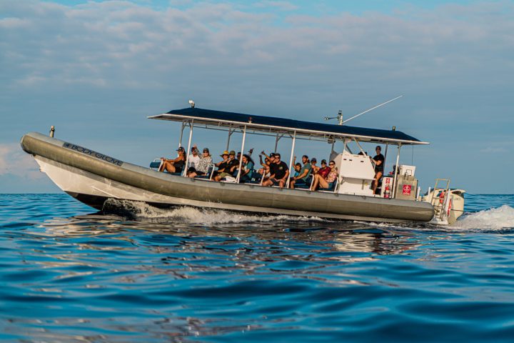 a group of people on a boat in the water